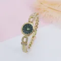 Close-up detail of women's gold quartz watch featuring starry dial and sparkling rhinestones. - Gold Green