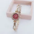 Elegant flower-shaped quartz women's watch with sparkling rhinestones and golden bracelet strap. - Rose Gold Red Face