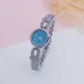 Detailed view of women rhinestone quartz watch with blue starry dial and dazzling bracelet strap. - Silver & Blue