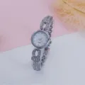 Rhinestone quartz bracelet watch detail, silver metal strap with sparkling crystal stones. - Silver White