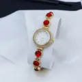 Gold color women bracelet quartz watch with red stones and elegant rhinestone dial details - Red