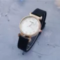 Women silicone quartz watch with white dial, rose gold arabic numerals, casual style detail. - Black