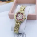 Detailed shot of the luxury gold women quartz watch with crystal paved square case and red dial. - Gold Red