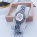 Elegant women quartz watch with square diamond encrusted dial and pink face, stylish wrist. - Silver Pink