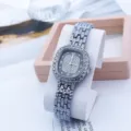 Exquisite square rhinestone quartz watch detail showcasing shimmering dial and elegant metal strap. - Silver Black
