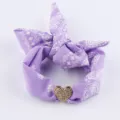 Detailed close-up of a purple paisley fabric accessory featuring a sparkling crystal heart charm. - SB03-2 Purple Paisley