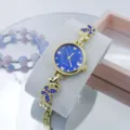 Prachtige dames quartz horloge met blauwe wijzerplaat en vlinder strass metalen band. - Goud Blauw