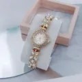 Exquisite rhinestone quartz watch detail, stunning floral dial and crystal butterfly bracelet. - Rose Gold White