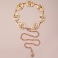 Cadena de cintura dorada de metal para mujer con placas ovaladas estilo western para vestidos. - Botas / Dorado