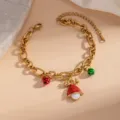 Close-up of Christmas stainless steel enamel bracelet featuring cute deer and bell charms. - Mushroom Style (0352)