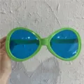 Übergroße Neuheit Party Sonnenbrille mit grünen Gestellen und blauen Gläsern für lustige Fotos. - Riesiges Oval / Grün