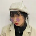 Vintage round metal frame sunglasses with purple lenses detail shot, stylish and classic. - Medium Round Gold Frame Purple Lens