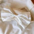 Luxuriöse Satin Schlafmaske mit Perlen Schleife, weich und bequem für angenehmen Nachtschlaf. - Aprikose