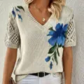 Detailed view of women's chic floral knit V-neck short sleeve top with stylish hollow-out sleeves. - S / Tops / Blue