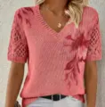 Close-up view of the V-neck knitted sweater featuring hollow-out sleeves and elegant floral print. - S / Tops / Red
