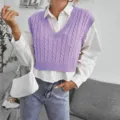 Detailed view of the stylish purple cable-knit V-neck crop sweater vest, perfect for layering. - Purple