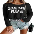 Close-up detail of the black knit sweater featuring white letter knitwear and round neckline style. - S / Black