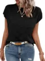 Close-up detail of black short-sleeve knit top with stylish textured square pattern. - Black