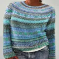 Close-up detail of the colorful striped knit sweater, showing soft texture and pattern. - S / Tops / 9127-Orchid Floral