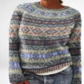 Detail view of the colorful geometric pattern knitted pullover, cozy knitwear fabric. - S / Tops / 9128-Floral
