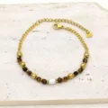 Detailed view of titanium steel bracelet with natural stones and freshwater pearl - Amber