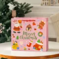 Cute pink Christmas gift bag with cartoon Santa and reindeer design for holiday party favors. - Pink