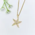 Collana con ciondolo a stella Marina in zircone cubico dorato, stile oceano elegante. - Girocollo Stella Marina con Strass (XL2606-073)