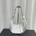 Silver metallic leather dumpling bag detail, showcasing unique crinkled texture and chain handle. - Small (27x15x3cm) / Silver