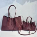 Close-up detail of luxurious maroon woven leather tote bags set, showing fine craftsmanship. - 40cm x 27cm x 17cm / Burgundy