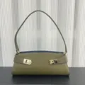 Detail view of the olive green leather shoulder bag with chic gold hardware and sleek strap. - Blank / Army Green