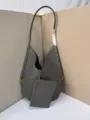Grey woven leather shoulder tote bag with matching pouch, soft hobo bag detailed view. - Gray