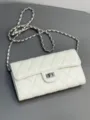 White quilted leather chain bag detail shot, classic turn lock and elegant shoulder strap design. - 18cm / Square Buckle / White