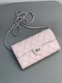 Close-up detail of the pink quilted leather crossbody bag featuring silver chain strap. - 18cm / Square Buckle / Pink