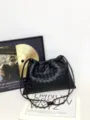 Detailed view of the black woven leather drawstring shoulder bag, featuring classic intrecciato design. - 32*21*1cm / Black