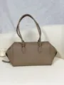 Taupe leather bowling bag detail, minimalist design, premium leather texture, elegant shoulder strap. - Blank / Elephant Gray