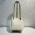 White woven leather bucket bag with metal chain strap, stylish shoulder handbag for women. - White