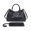 Black woven leather handbag detail shot showing exquisite craftsmanship and texture. - Black