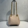 Stylish woven leather shoulder bag with metal chain strap, elegant pink bucket bag design for women. - Embossed Pink