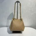 Khaki woven leather bucket bag with metal chain strap, fashionable casual shoulder handbag. - Milk Tea