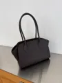 Detailed view of the dark brown leather tote bag showing fine stitching and minimalist structure. - Alphabet / 12-Inch Smooth Coffee