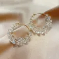 Elegant gold-tone hoop earrings adorned with faceted clear crystal beads, perfect for daily wear. - Transparent Beads