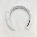 Close-up detail of the white plush braided sponge headband showing soft fabric and inner tag. - Twisted Sponge Headband / White