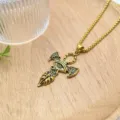 Detailed shot of retro gold eye ankh pendant necklace with delicate rhinestones and chain. - XL0998-1 Gold