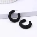 Matte black twisted hoop earrings for women, minimalist chic U-shaped fashion ear jewelry. - Black