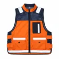 Close-up view of the reflective safety vest featuring multiple functional pockets and mesh. - L / Orange