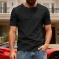 Detail view of a stylish black short-sleeve Henley shirt with button placket for men. - S / Black