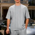 Detail view of mens grey jacquard knit oversized short sleeve t shirt and shorts lifestyle. - Light Gray