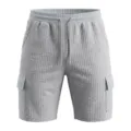 Men's gray waffle knit cargo shorts with elastic drawstring waist and side utility pockets. - Light Gray