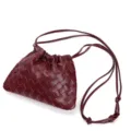 Burgundy woven leather shoulder bag detail, showcasing intricate intrecciato pattern. - Burgundy