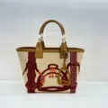 Canvas leather tote bag with equestrian print and stirrup charm, large capacity handbag detail. - Totem Apricot